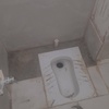 تعویض کاسه توالت با کاشی‌کاری 